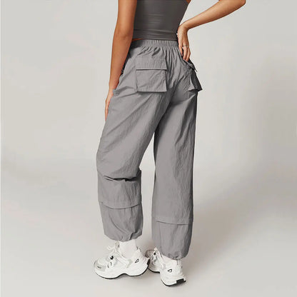 Calças de trabalho respiráveis à prova de vento calças de yoga femininas bolsos elásticos e soltos leggings correndo e calças esportivas casuais